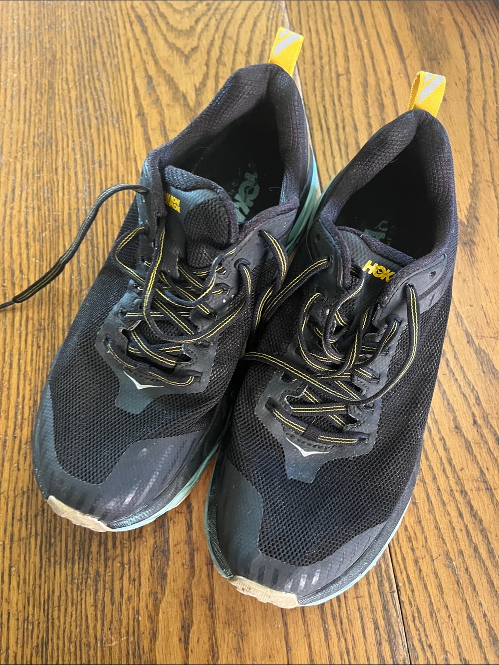 Hoka Black Athletic Shoes with Yellow Pull Tabs